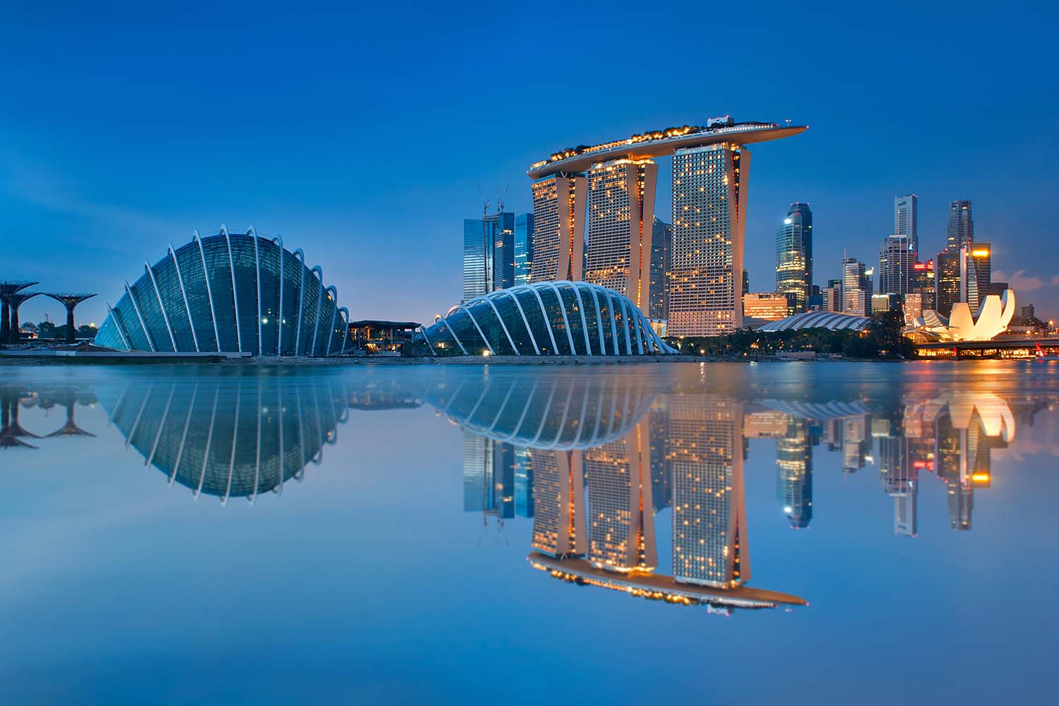 Gardens by the Bay and the skyline in Singapore, one of our favorite winter vacation spots